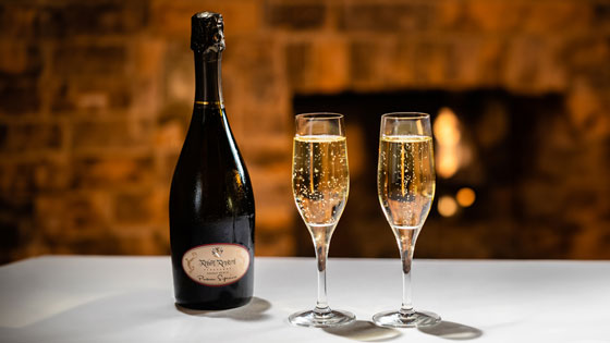 Two champaign flutes of sparkeling wine placed on a table at Pechanga Resort Casino's Great Oak Steakhouse Restaurant in Temecula, CA